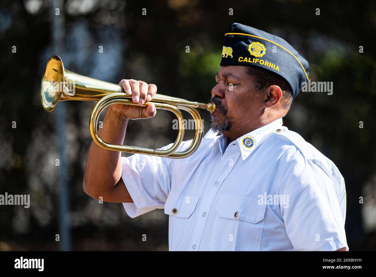 A member of the American Legion Post 534 plays the bugle during a Remembrance Day ceremony at Pine Grove Cemetery in Orcutt, Calif., Nov. 11, 2022. Combined Force Space Component Command members from the U.S., U.K., Australia, and Canada participated in the ceremony, held by the American Legion Post 534, which was a tribute to those who gave their lives in World War I, and to all the men and women who have served since. Stock Photo