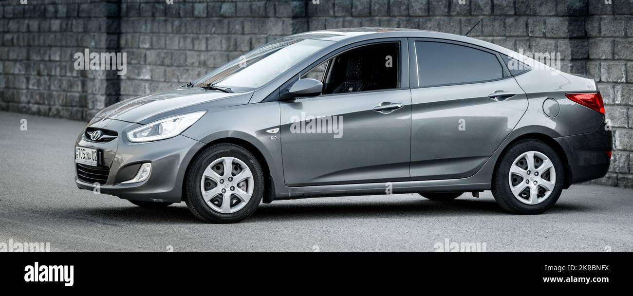 Hyundai accent in grey color 2014, left side view Stock Photo - Alamy