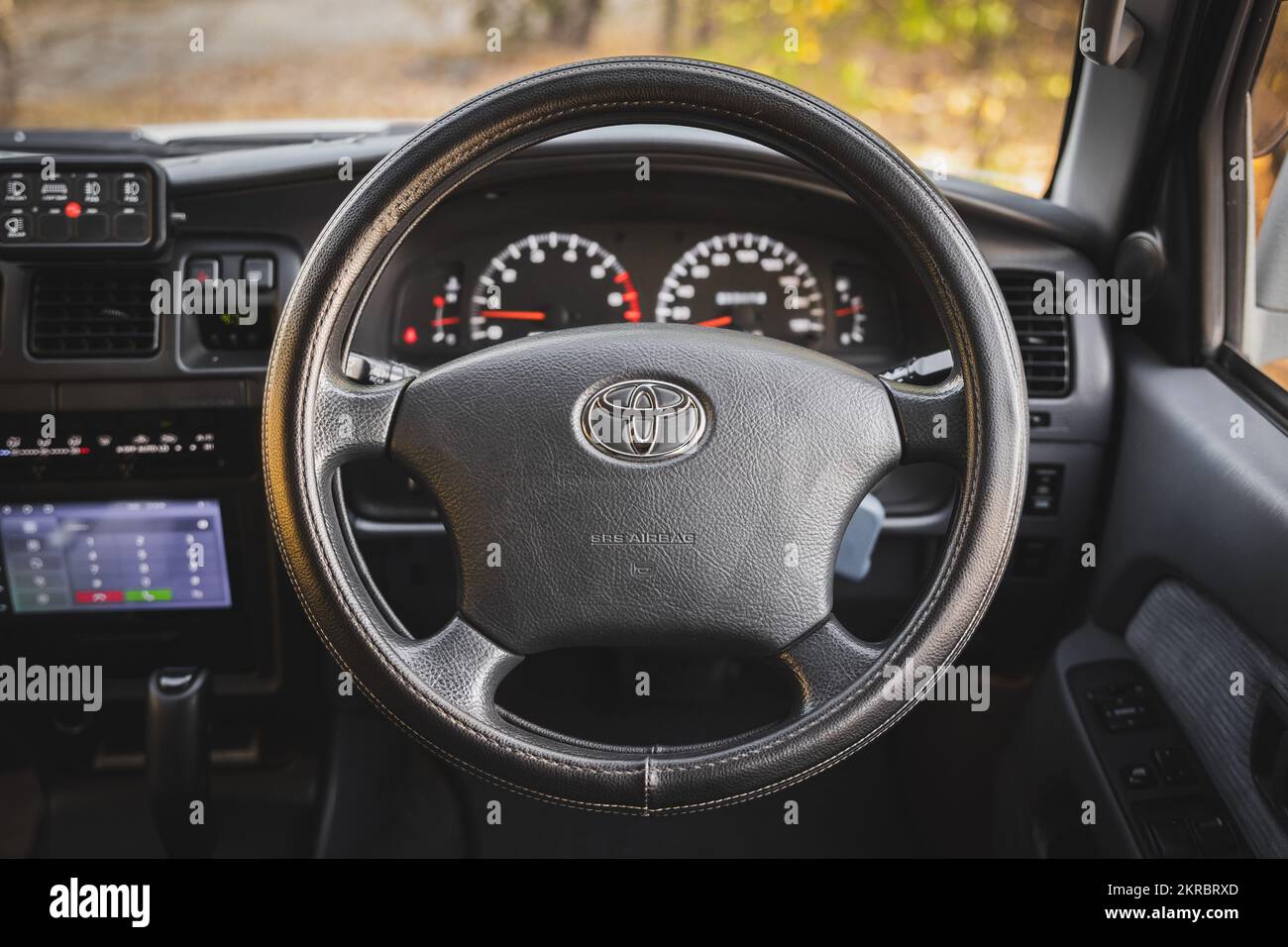 Interior of the offroad car Toyota hilux surf with toyota prado steering wheel. right hand drive