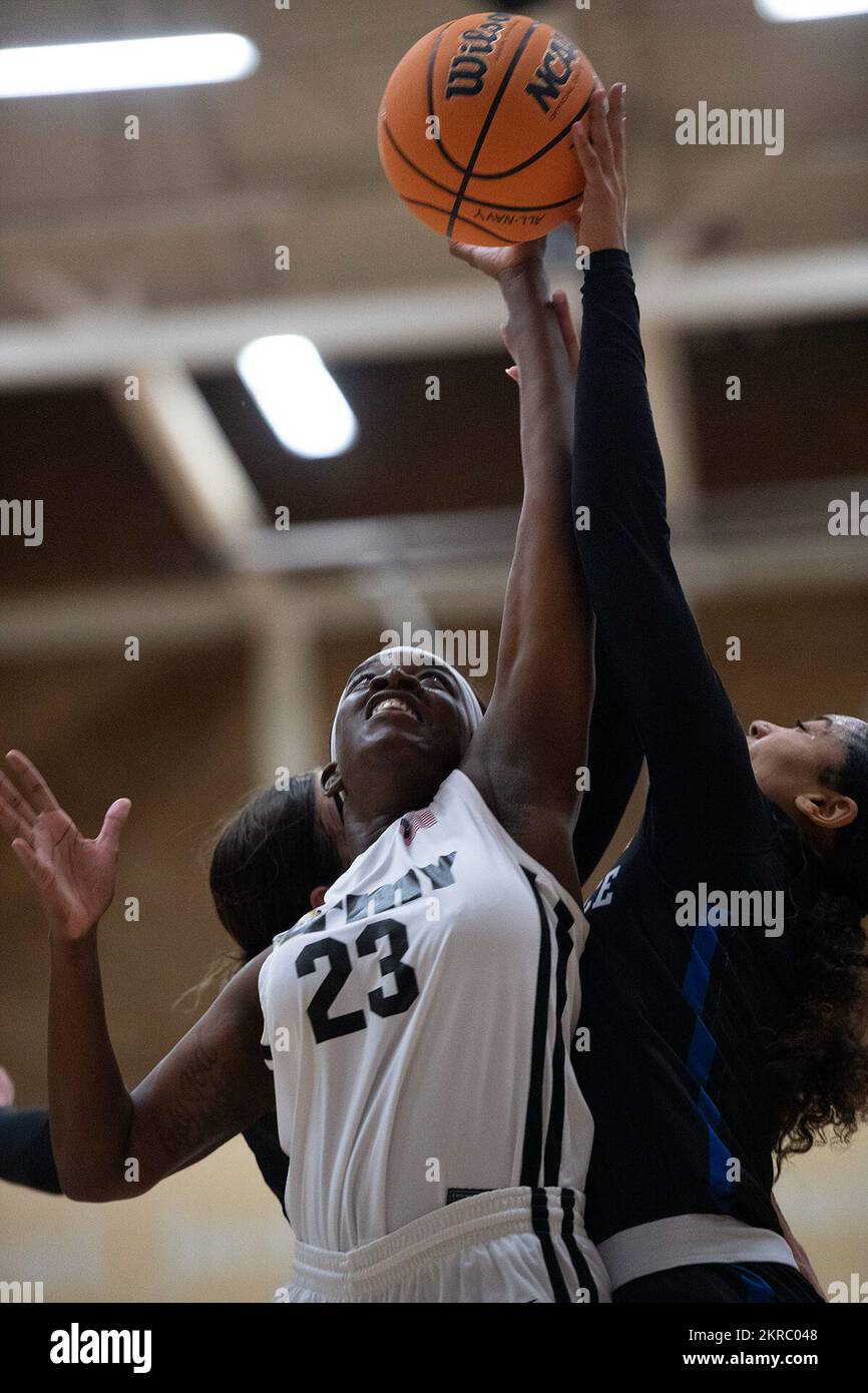 Army Spc. Malayasia McHenry grabs a rebound during the women’s championship of the 2022 Armed Forces Men’s and Women’s Basketball Championships at Naval Base San Diego, in San Diego, Calif. Nov. 12, 2022. Navy leads Marines 44 – 22 at the end of the second period. Stock Photo