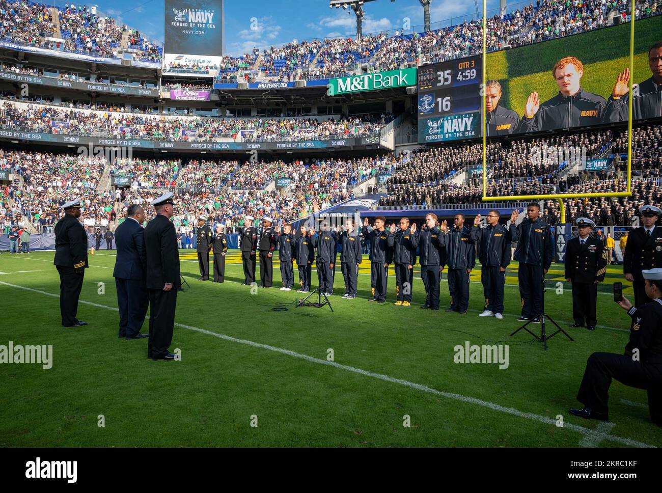 221112-N-WF272-2400 BALTIMORE (Nov. 12, 2022) U.S. Secretary of the Navy Carlos Del Toro administers the oath of enlistment to future U.S. Navy Sailors, recruited by Navy Talent Acquisition Group Philadelphia, during the Navy-Notre Dame football game held at M&T Bank Stadium in Baltimore, Nov. 12, 2022. The game marked the 23rd time the city of Baltimore has hosted a Navy-Notre Dame game and the first since 2008. NTAG Philadelphia encompasses regions of Pennsylvania, New Jersey, Delaware, Maryland and West Virginia, providing recruiting services from more than 30 talent acquisition sites with Stock Photo