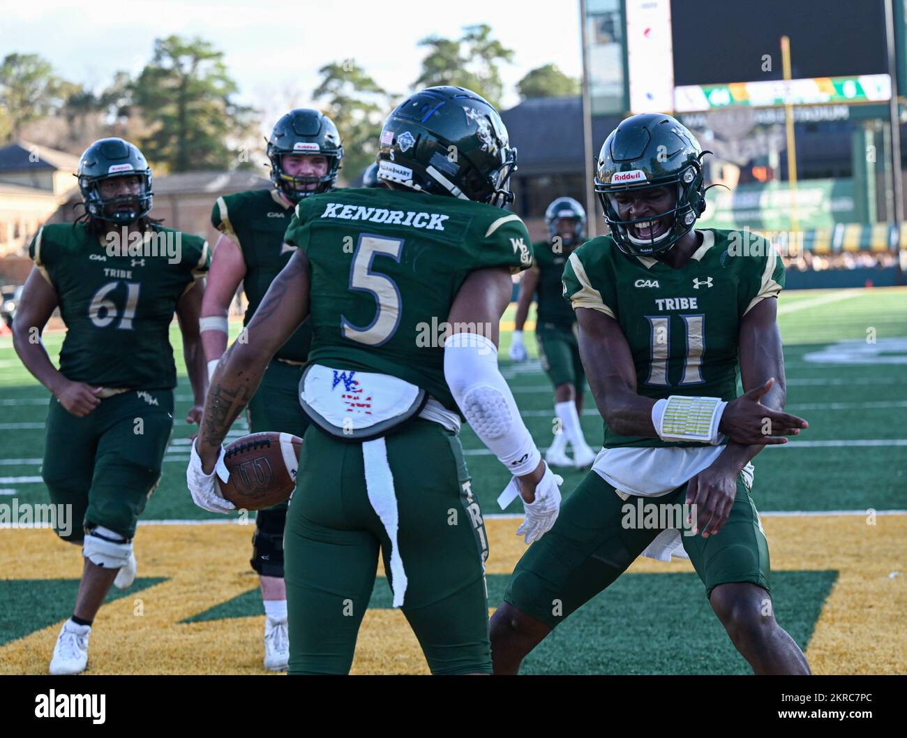 DreSean Kendrick, William and Mary Tribe football player, front, celebrates with Darius Wilson, William and Mary Tribe football player, back right, after Kendrick scored a touchdown during the U.S. Military Appreciation game at the College of William and Mary, Williamsburg, Virginia, Nov. 12, 2022. This was Kendrick’s first touchdown of the season. Stock Photo