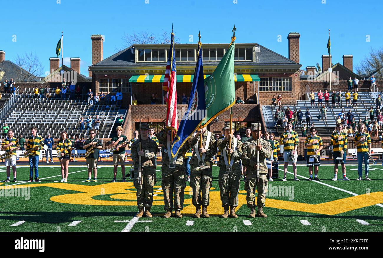 U.S. Army Soldiers present the colors during the national anthem at the William and Mary Tribe Military Appreciation football game at the College of William and Mary, Williamsburg, Virginia, Nov. 12, 2022. This football game was held to show support for U.S. military service members and strengthen the longstanding relationship between Joint Base Langley-Eustis and the local community. Stock Photo
