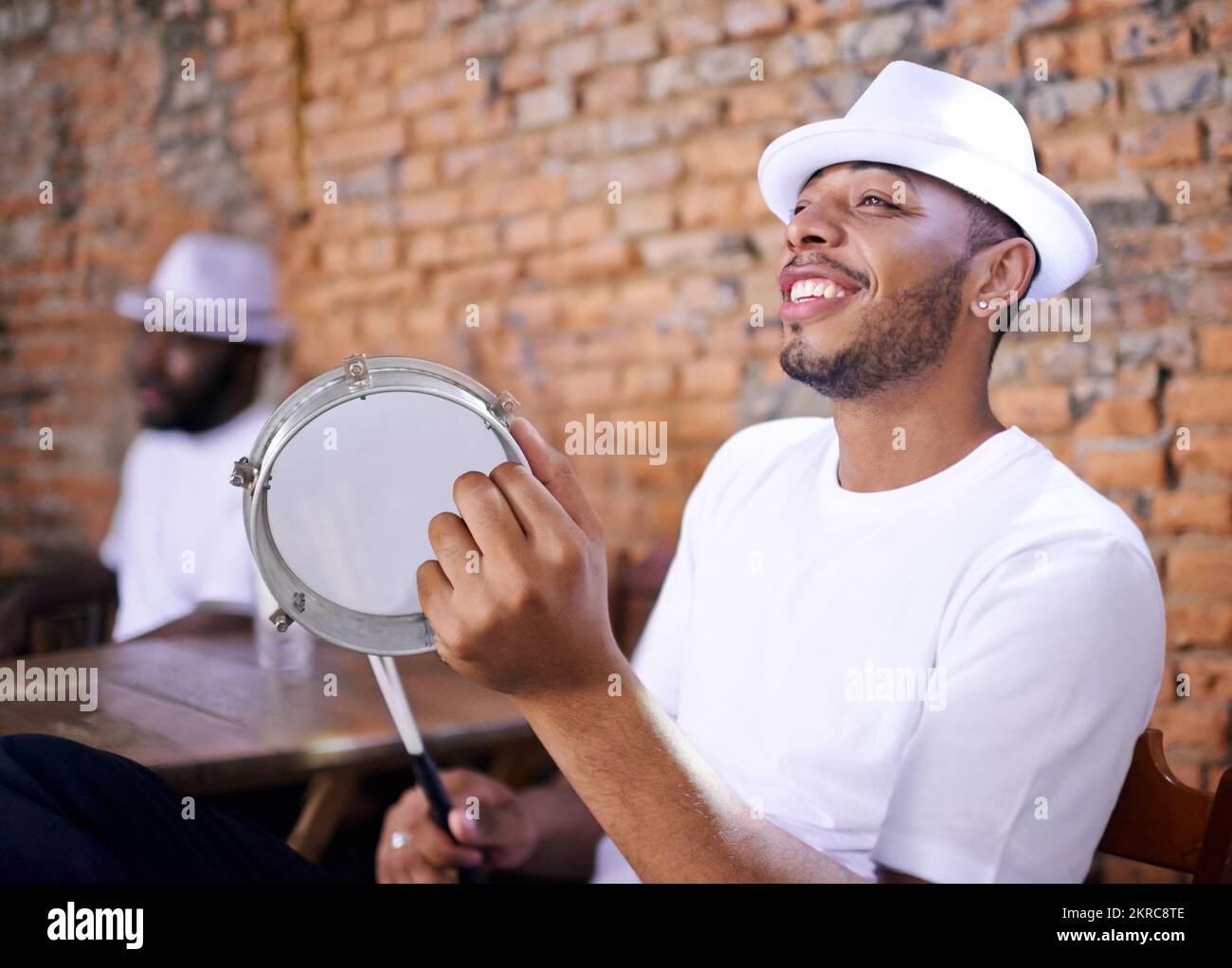 Bringing Brazil to life with their beats. a band playing their percussion instruments in a