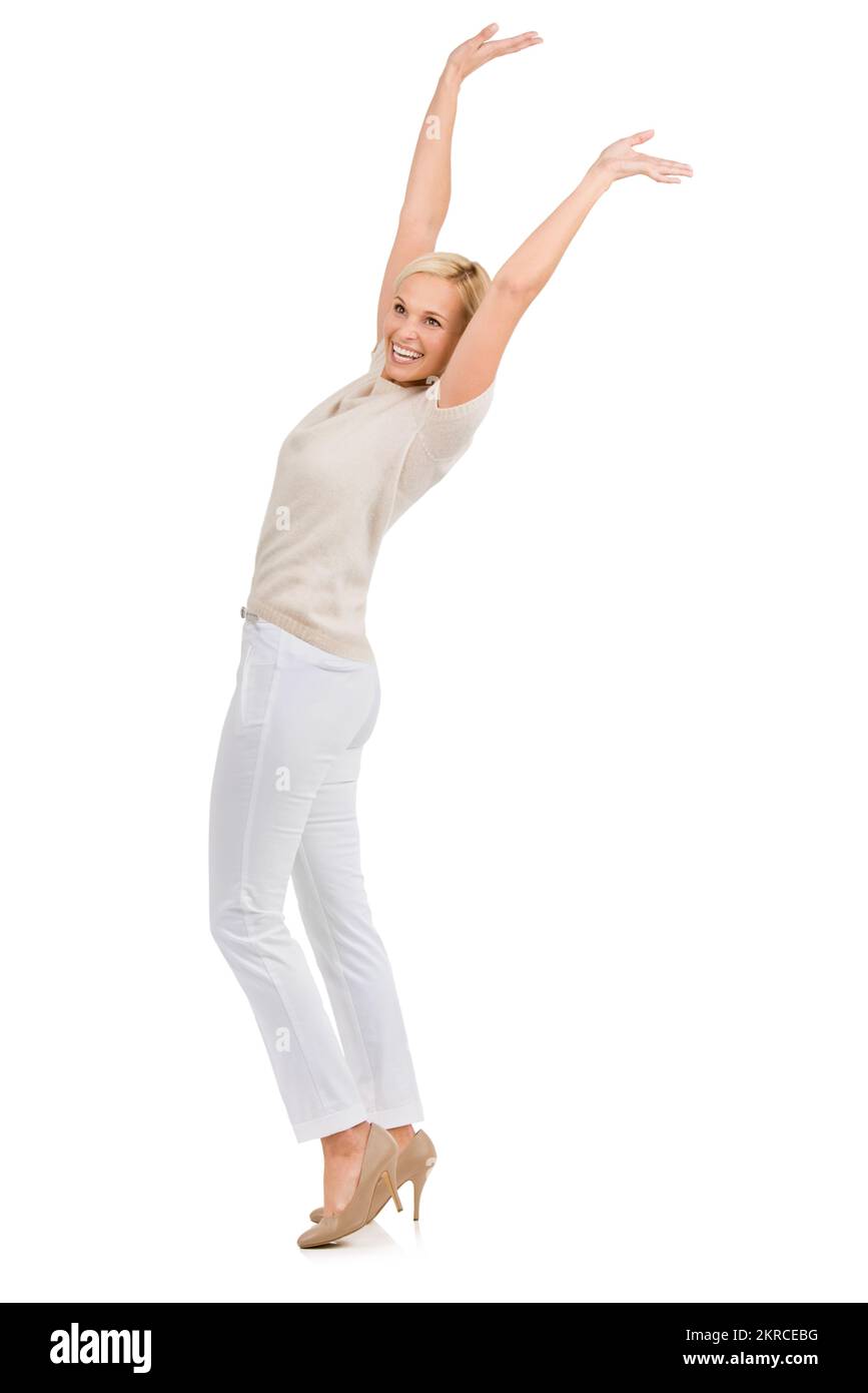 I did it. A happy young blonde woman smiling with her hands in the air. Stock Photo