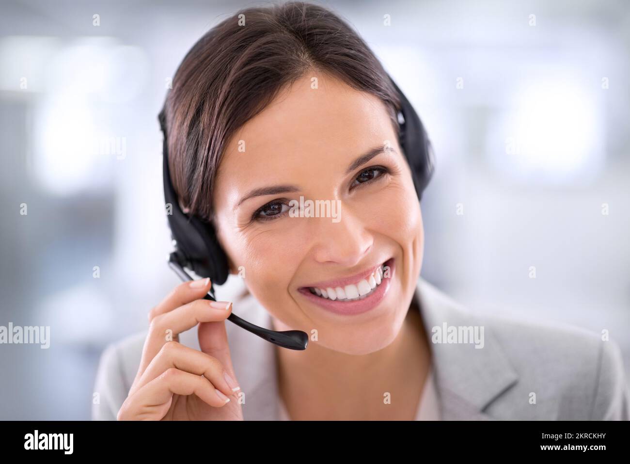 She goes the extra mile for her clients. an attractive customer support agent. Stock Photo