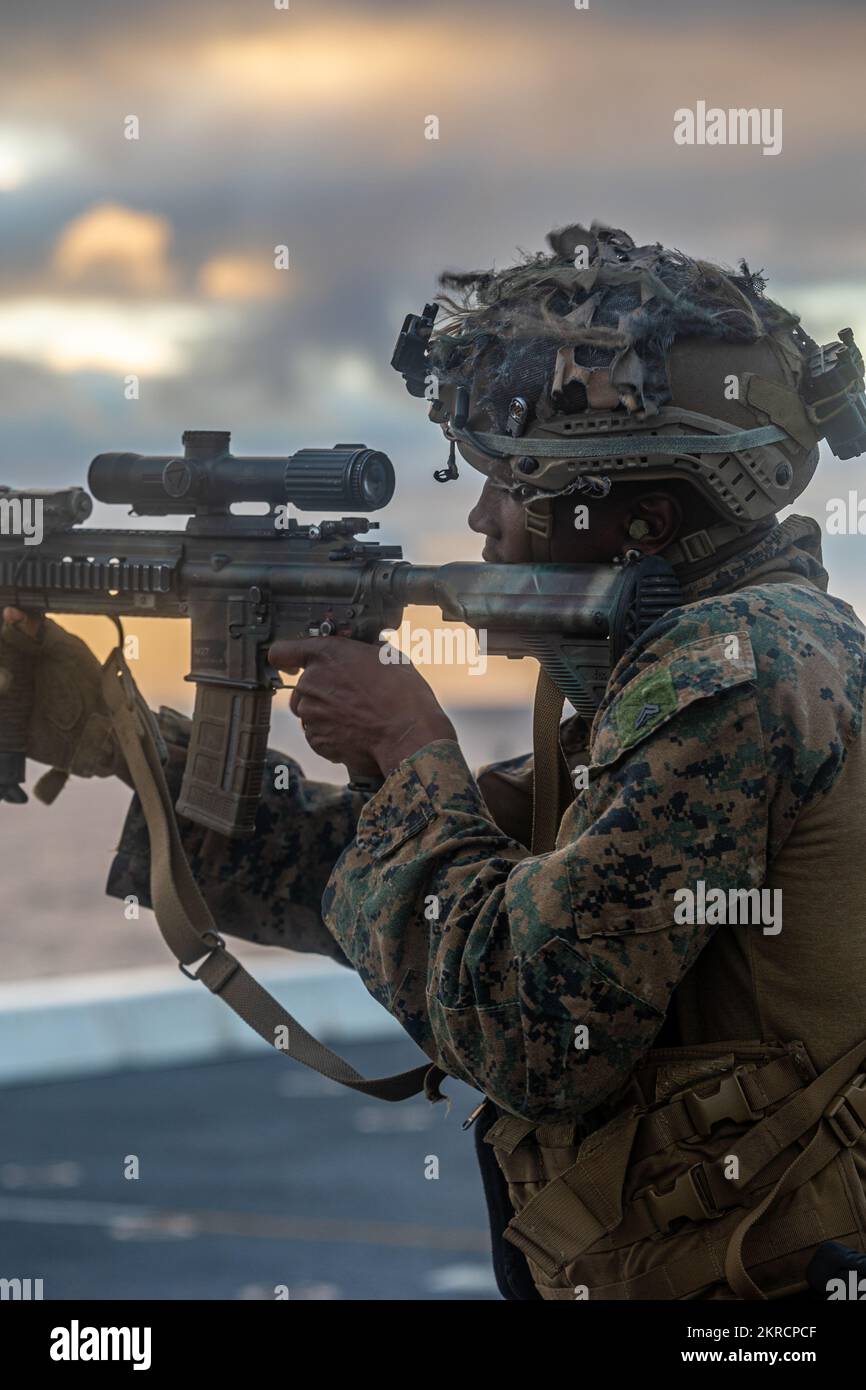 Cpl. Keeorris Smart, an assistant patrol leader with 1st Battalion, 2nd Marines operates a M4 service rifle during Keen Sword 23, aboard the USS Orleans LPD-18 in the Pacific Ocean, Nov. 13, 2022. Keen Sword is a biennial training event that exercises the combined capabilities and lethality developed between 3d Marine Division, III Marine Expeditionary Force and the JGSDF. This bilateral field-training exercise between the U.S. military and the JGSDF strengthens interoperability and combat readiness of the U.S.-Japan Alliance. Smart is a native of Duval County, FL. Stock Photo