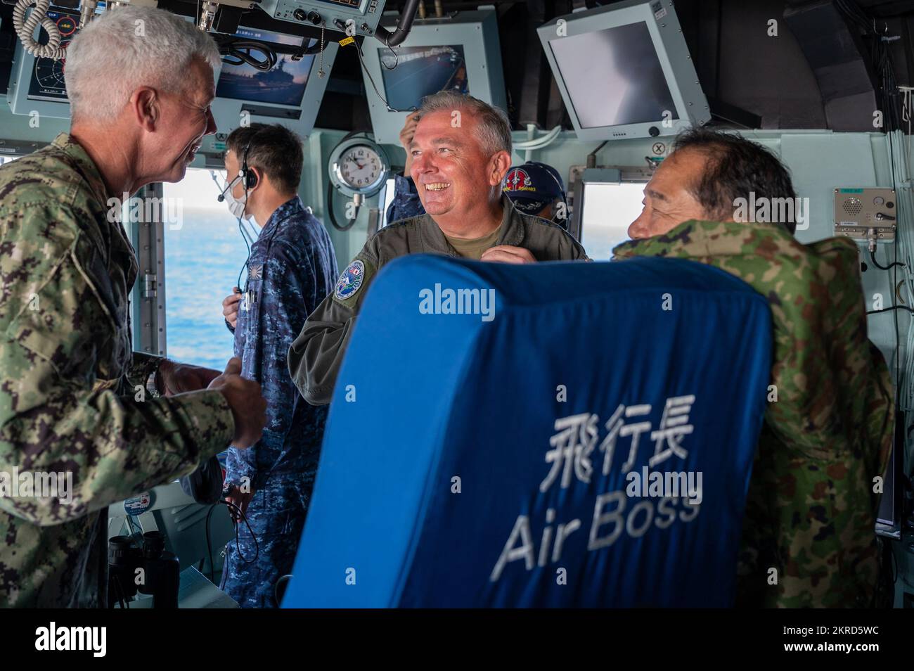 Lt. Gen. Ricky Rupp, commander of U.S. Forces Japan and Fifth Air Force, speaks with General Yamazaki Koji, chief of staff of the Japan Joint Staff, and Vice Adm. Robert Thomas, Jr., commander of U.S. 7th Fleet, aboard the Japanese destroyer JS Izumo during Exercise Keen Sword 23, Nov. 14, 2022. Rupp visited the JS Izumo to participate in and observe Keen Sword events. Keen Sword is a biennial, joint, and bilateral field-training exercise, involving the U.S. military and Japan Self-Defense Forces, designed to increase readiness and interoperability while strengthening the ironclad Japan-U.S. a Stock Photo