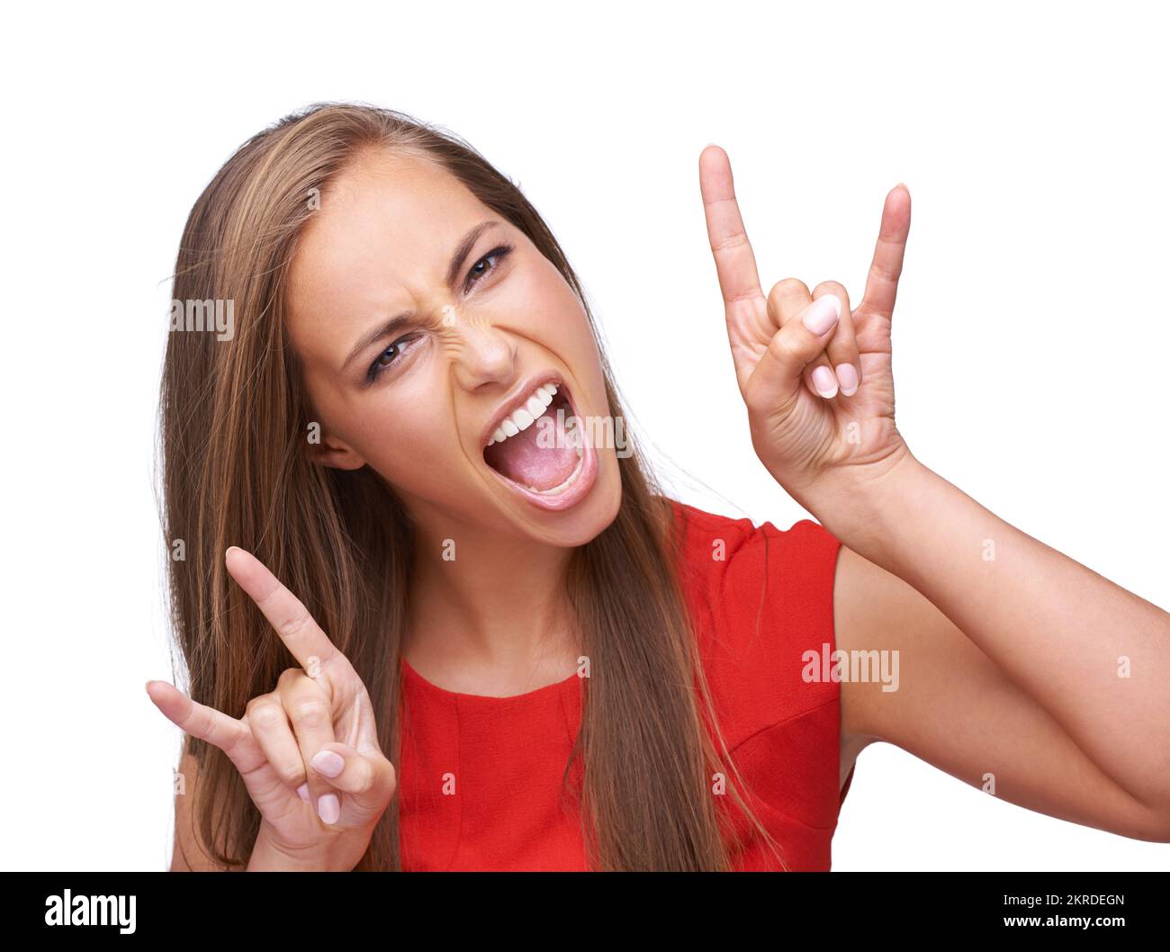 Yeah. an attractive young woman giving the rock and roll sign. Stock Photo
