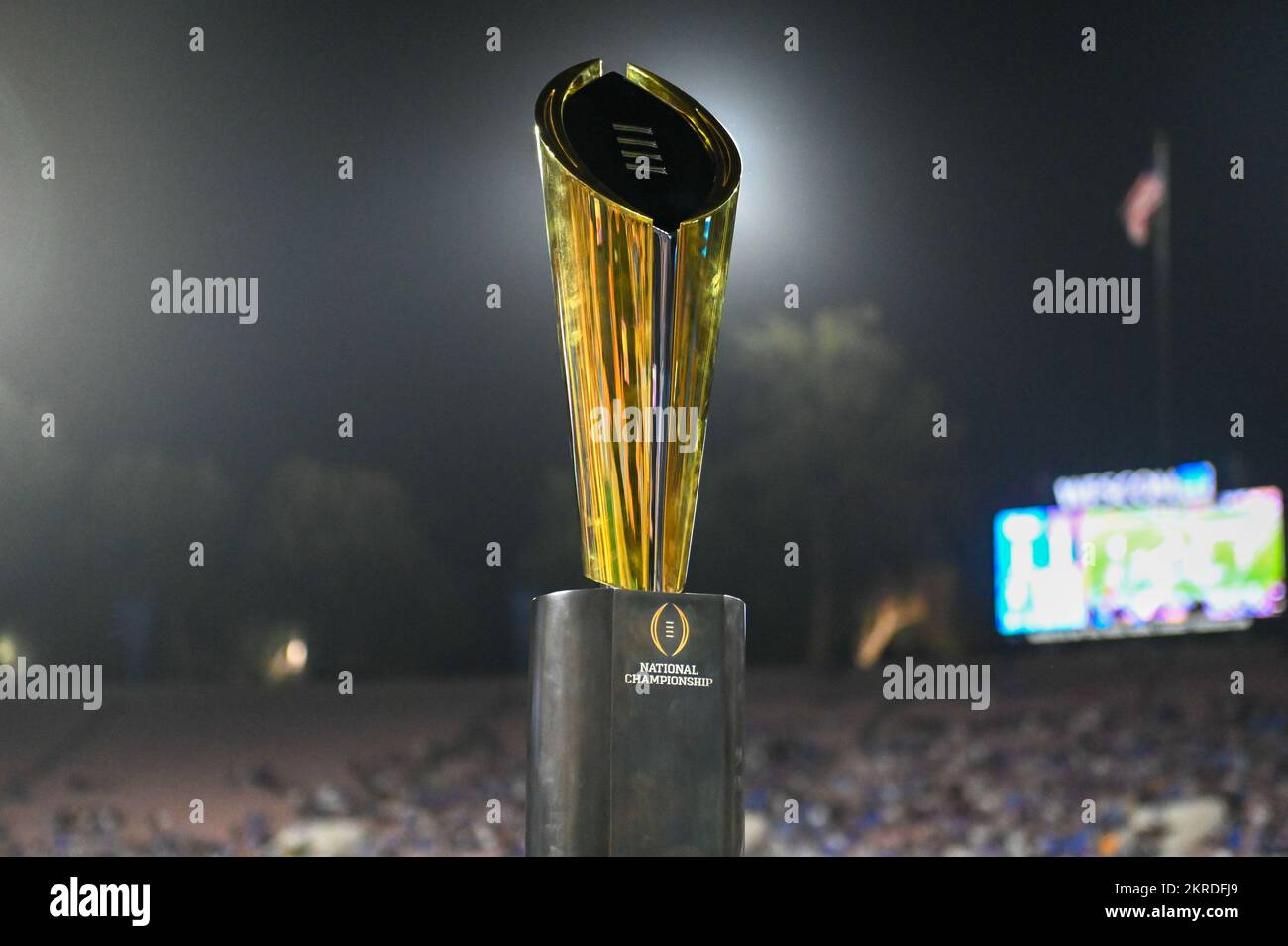 The College Football Playoff National Championship trophy sits on the sideline during an NCAA football game between the UCLA Bruins and the Washington Stock Photo