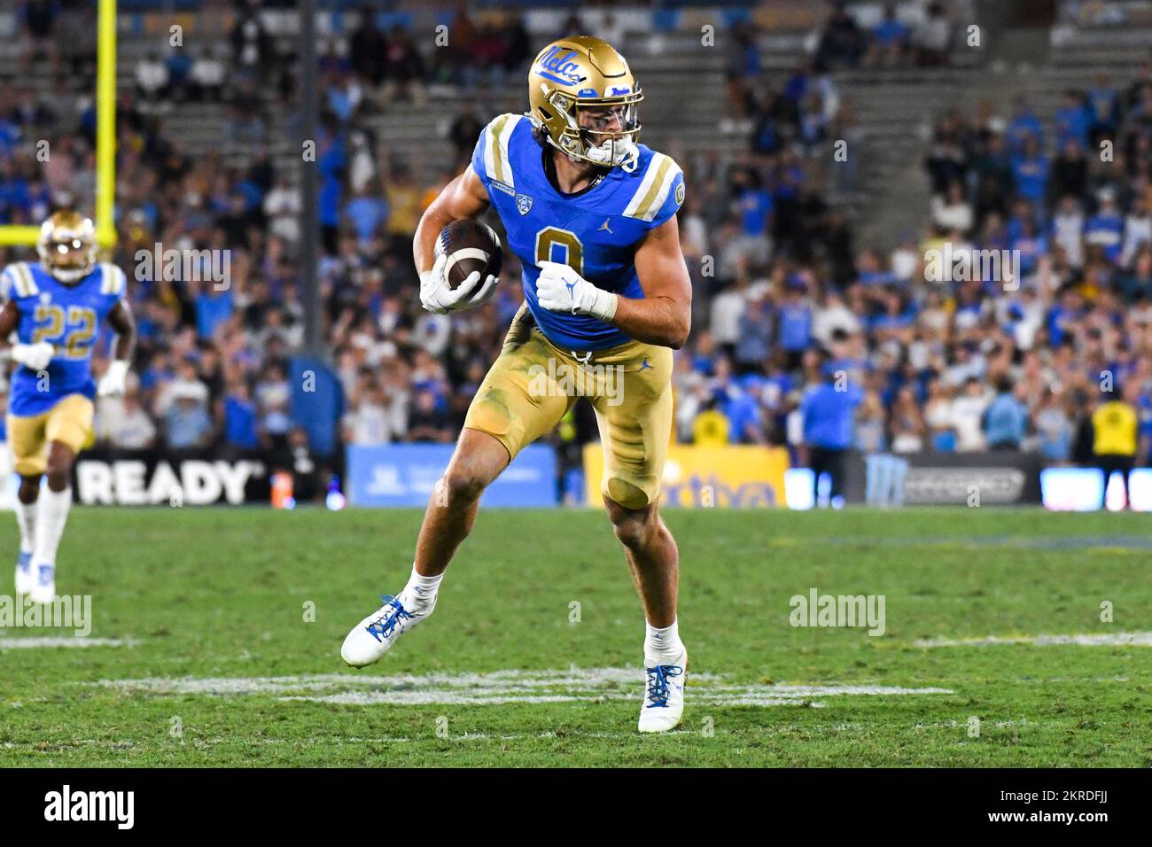 UCLA Bruins wide receiver Jake Bobo (9) runs with the ball during an NCAA football game against the Washington Huskies, Friday, Sep. 30, 2022, in Pasa Stock Photo