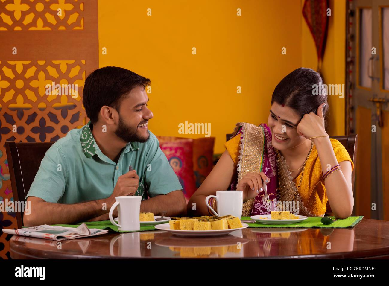 Gujrati couple talking during breakfast Stock Photo
