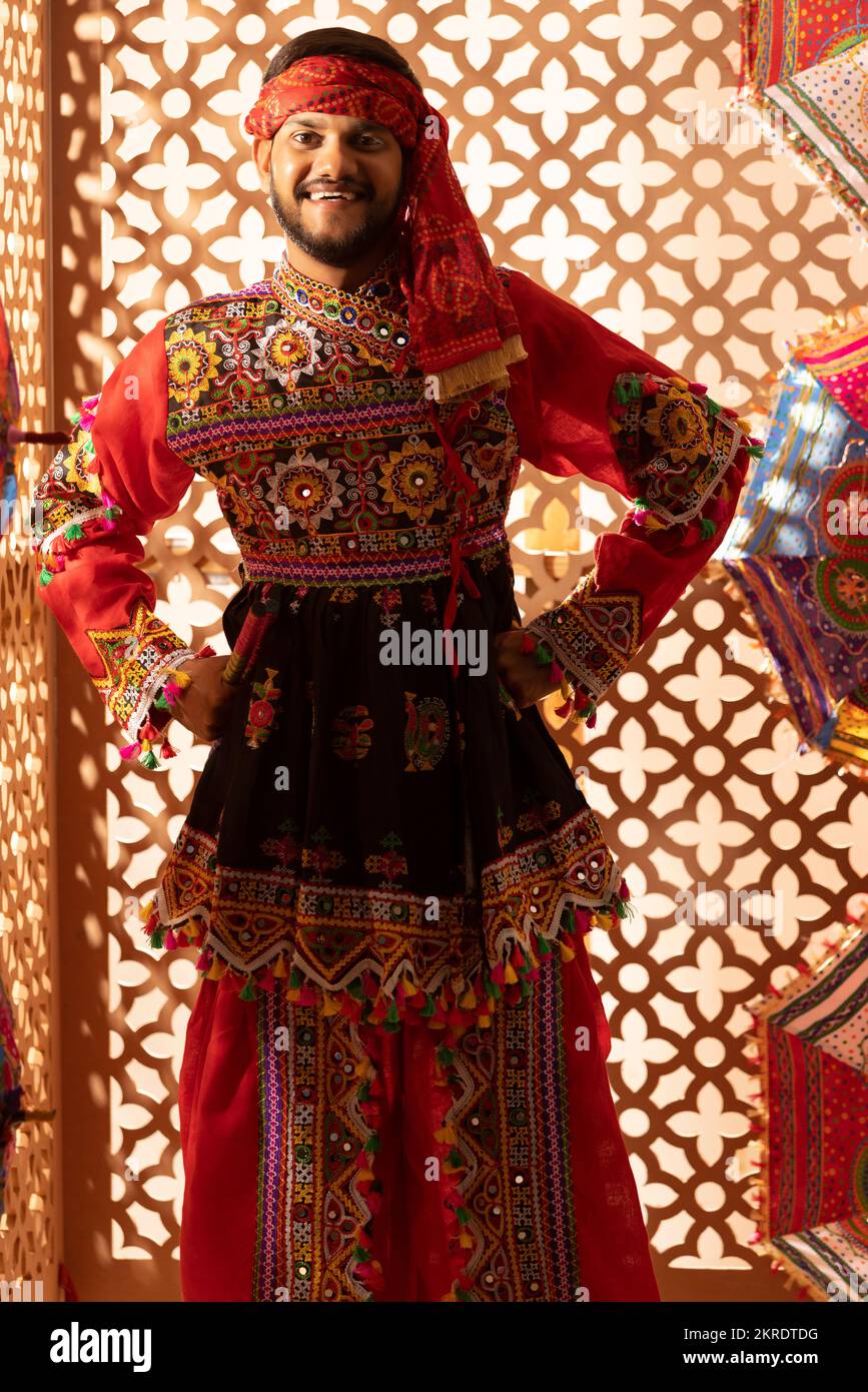 Portrait of Gujrati man with dandiya sticks Stock Photo - Alamy