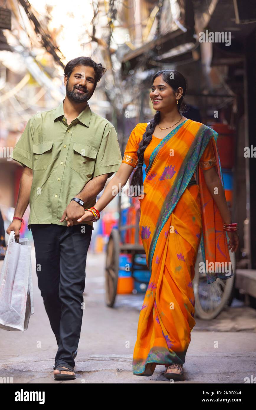 Indian couple holding hands walking hi-res stock photography and images ...