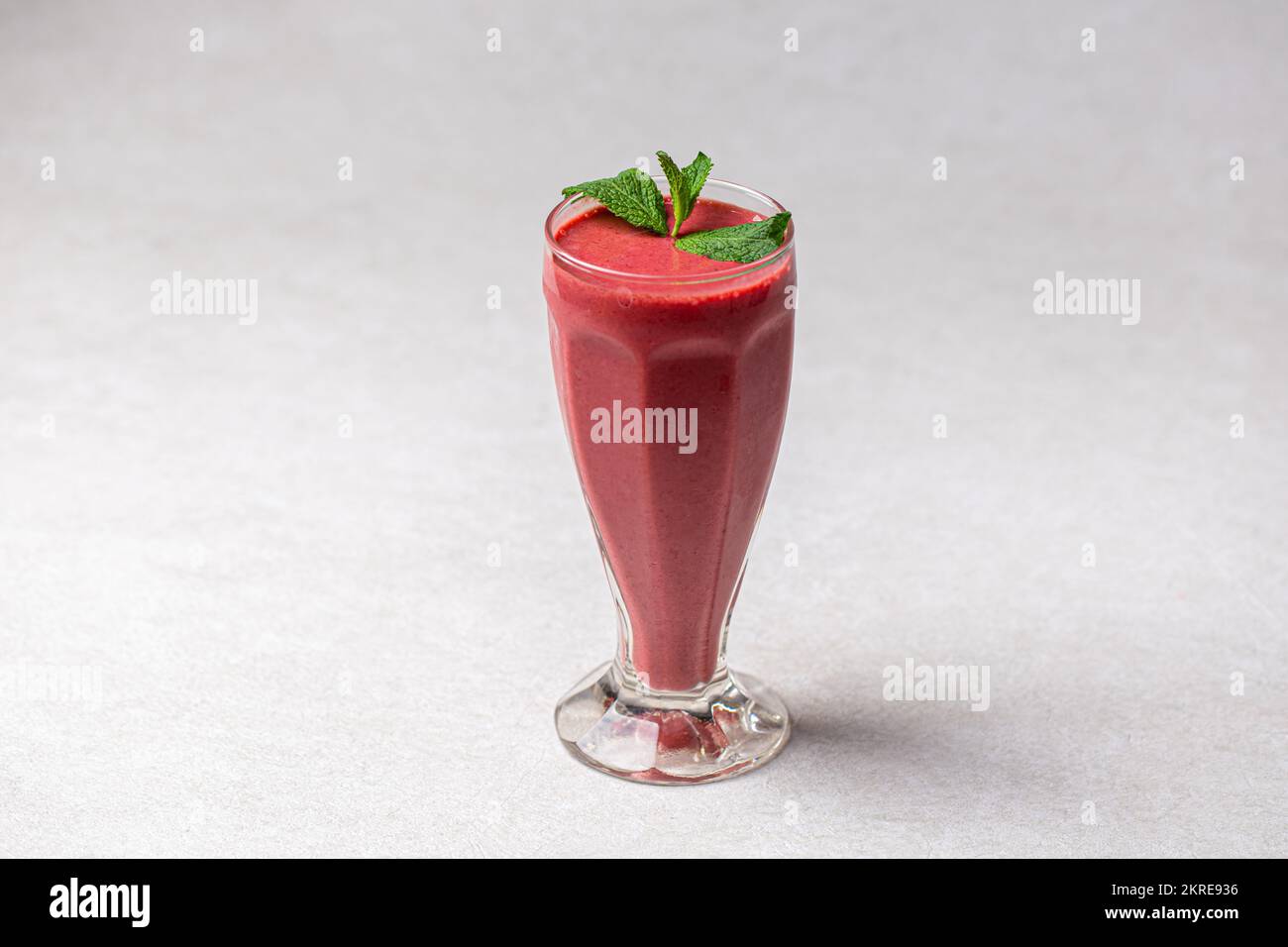 Glass of fresh berry smoothie with mint Stock Photo