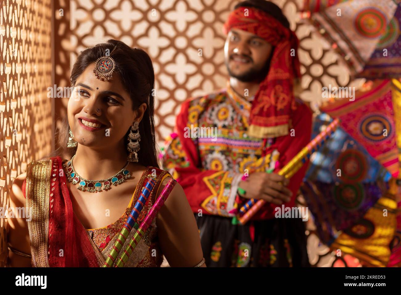Portrait of Gujrati couple with dandiya sticks Stock Photo - Alamy