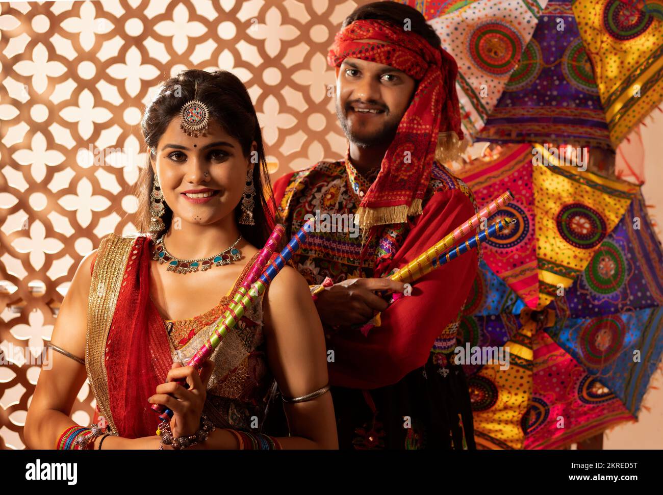 Portrait of Gujrati couple with dandiya sticks Stock Photo - Alamy