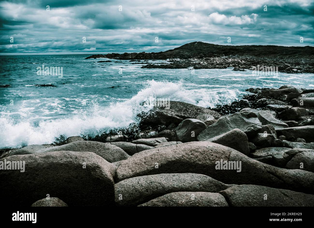 Fine art Tasmania landscape on a dramatic blue rocky coastline under