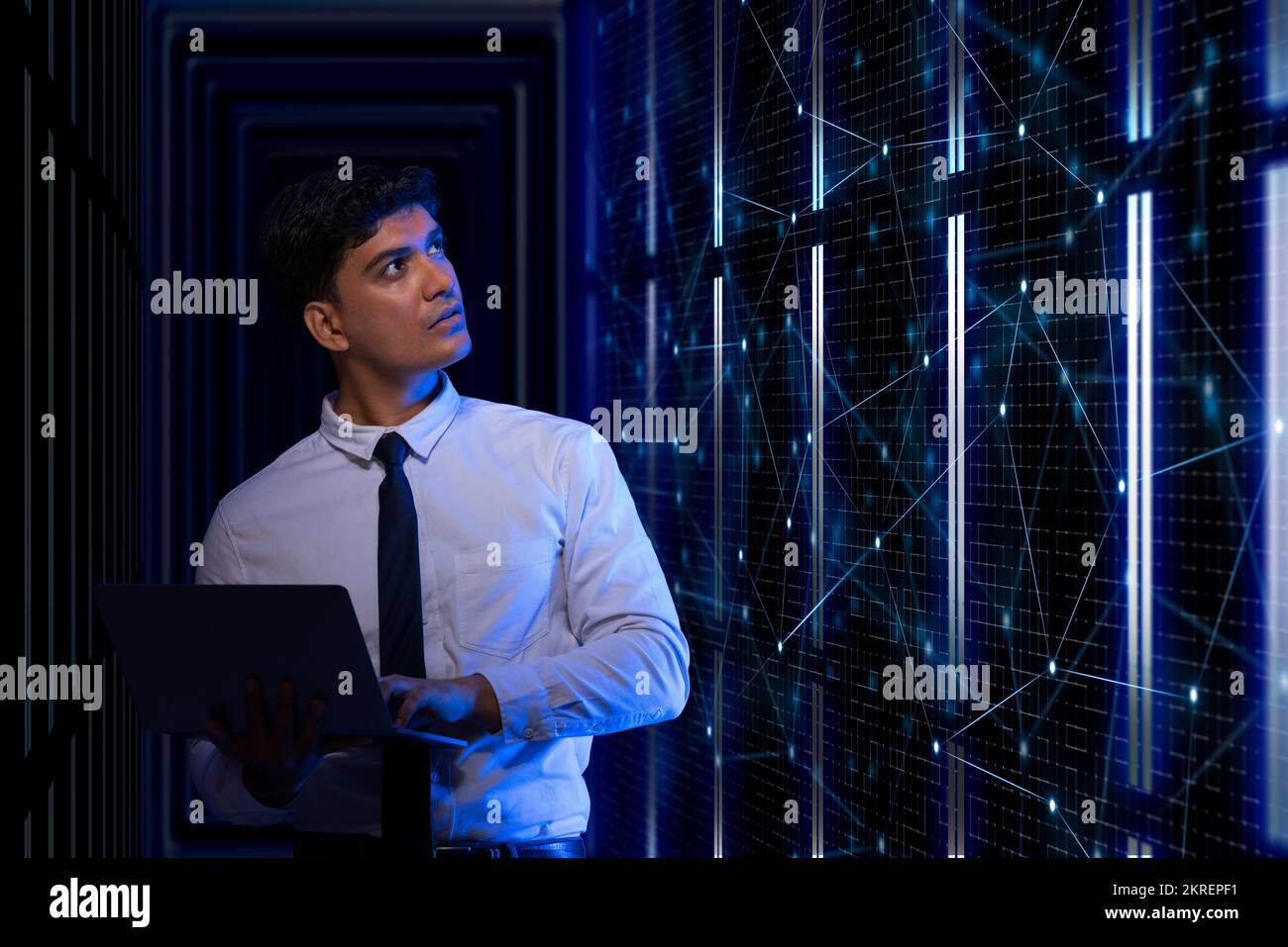 Technician working on the server in the data storage room. Stock Photo