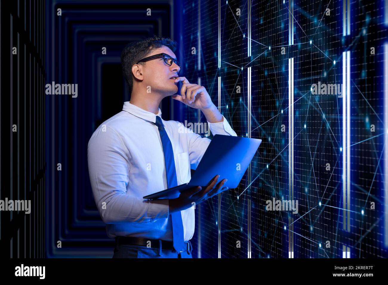 Technician working on the server in the data storage room. Stock Photo