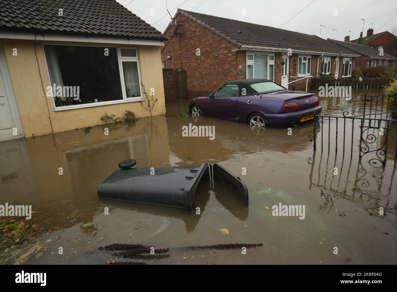File photo dated 12/11/2019 of a house surrounded by floodwater in Fishlake, Doncaster. Thousands more homes could be at high risk of surface floods driven by climate change and urbanisation in the coming decades, government advisers have warned. A new report from the National Infrastructure Commission (NIC) warns the number of homes and properties in England that are at risk of surface water flooding could rise from 325,000 today to 600,000 in the next 30 years. Issue date: Tuesday November 29, 2022. Stock Photo