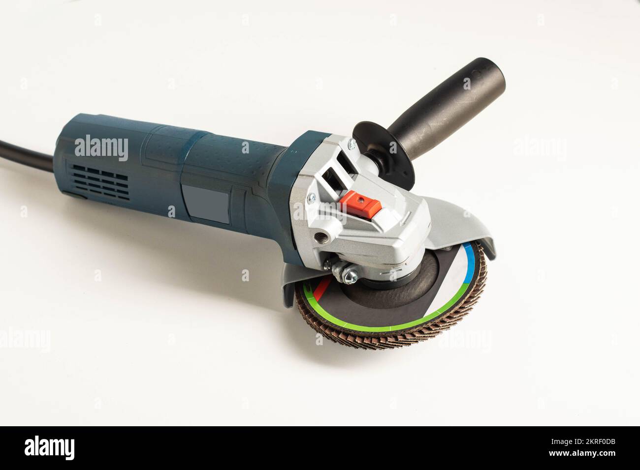 Modern professional angle grinder with a flap wheel on a white