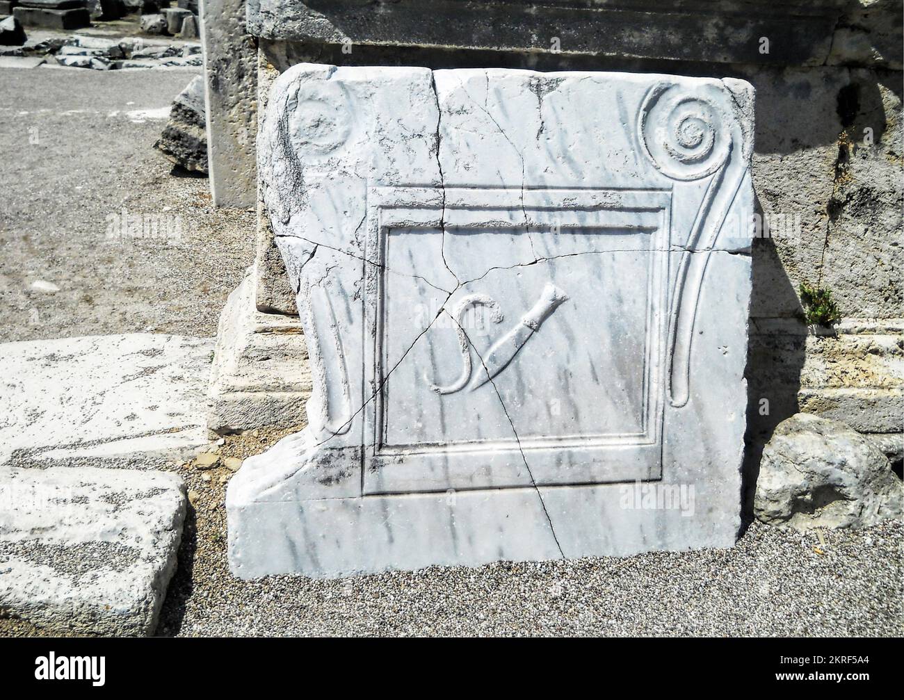 Antalya, Turkey, May 2014: A knife figure on a white marble at the ancient site of Perge. In ancient times this would have used as a butcher shop Stock Photo
