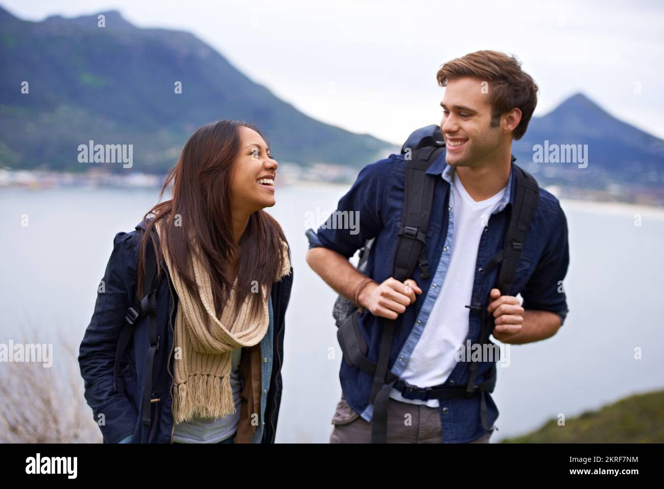 Exploration of nature and their love. A young couple with backpacks enjoying nature. Stock Photo
