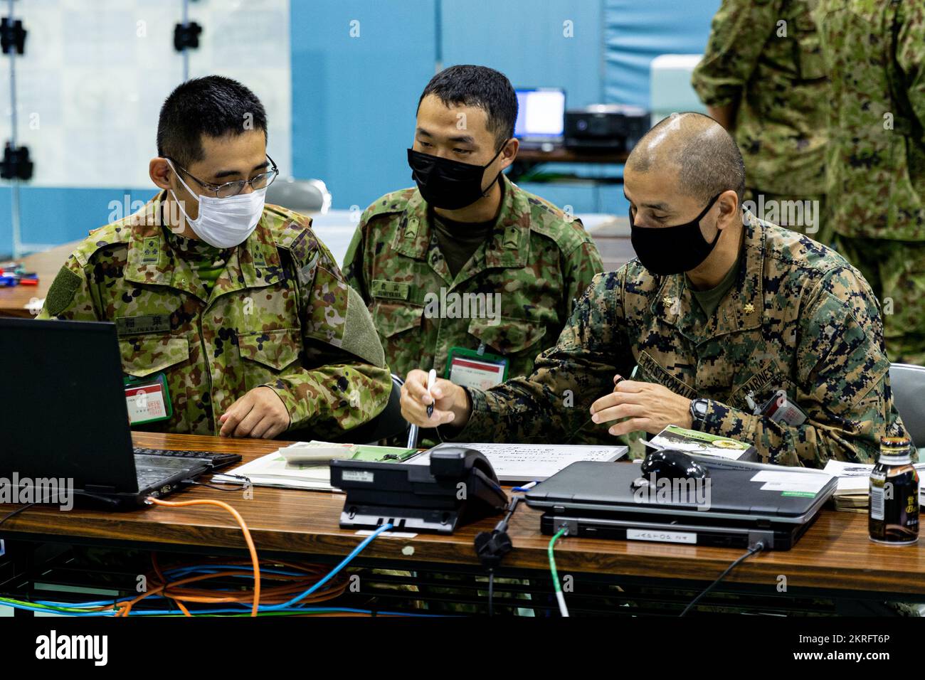 U.S. Marine Corps Maj. Frank Mastromauro, logistics officer for 12th Marine Regiment, and Japan Ground Self-Defense Force members with 14th Brigade synchronize operations in a Bilateral Ground Tactical Coordination Center during Keen Sword 23 in Yonaguni, Japan, Nov. 16, 2022. Keen Sword is a biennial training event that exercises the combined capabilities and lethality developed between 3d Marine Division, III Marine Expeditionary Force and the JGSDF. This bilateral field-training exercise between the U.S. military and Japan Self-Defense Force strengthens interoperability and combat readiness Stock Photo