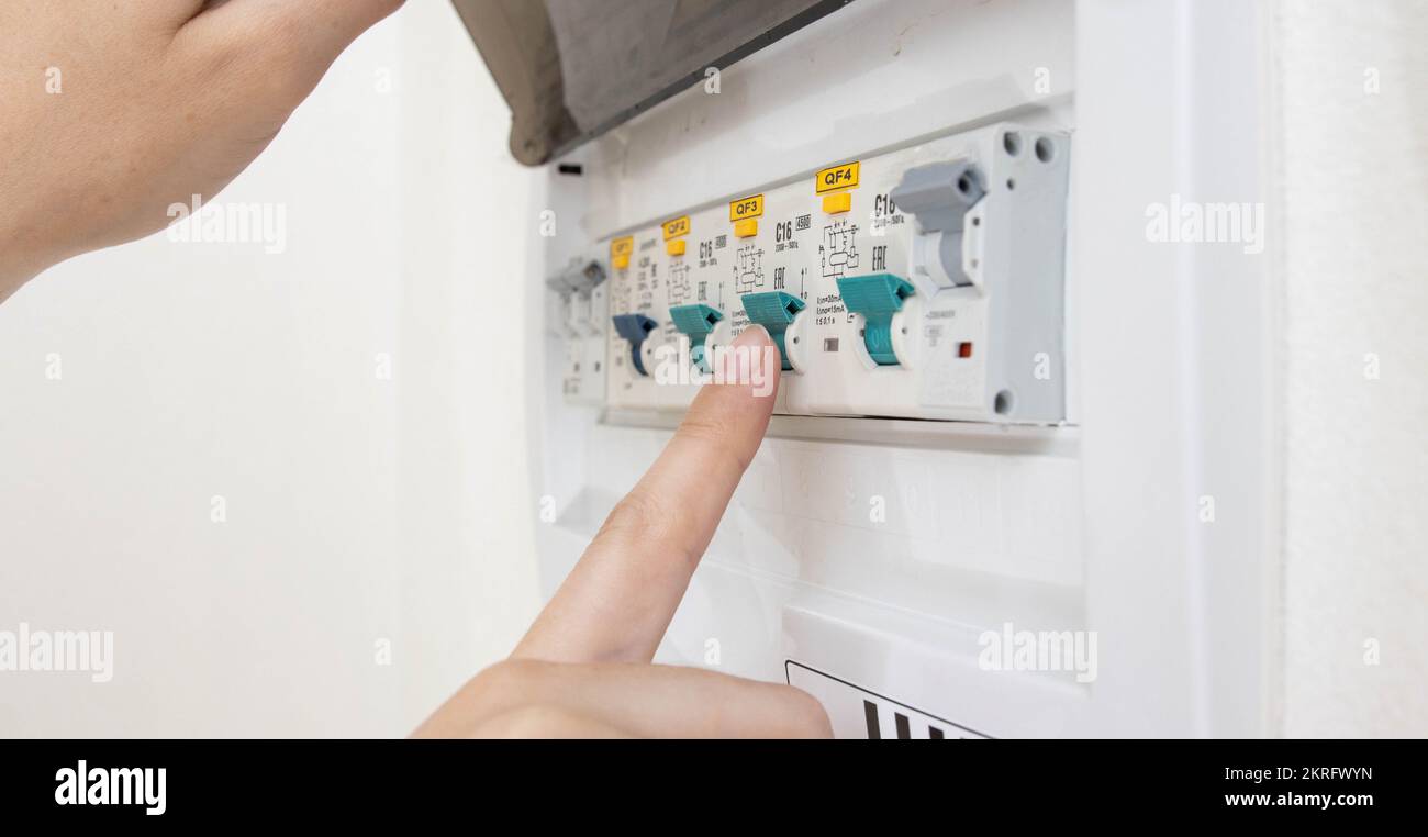 A person turns on an electric semi-automatic device with his finger to ...