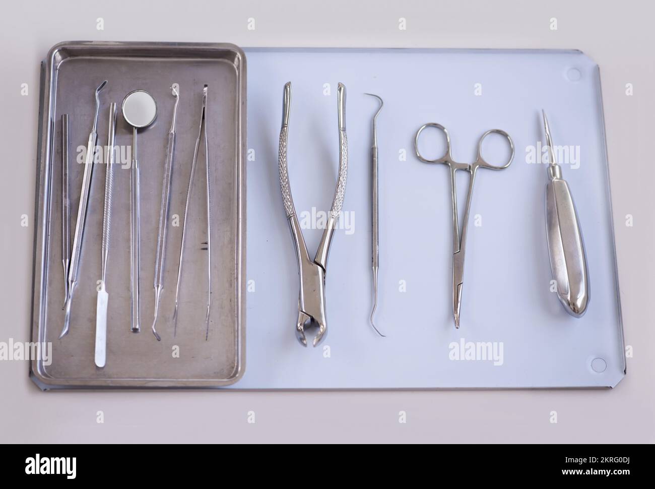The tools of the dentistry trade. a variety of dentists tools lying on a tray. Stock Photo