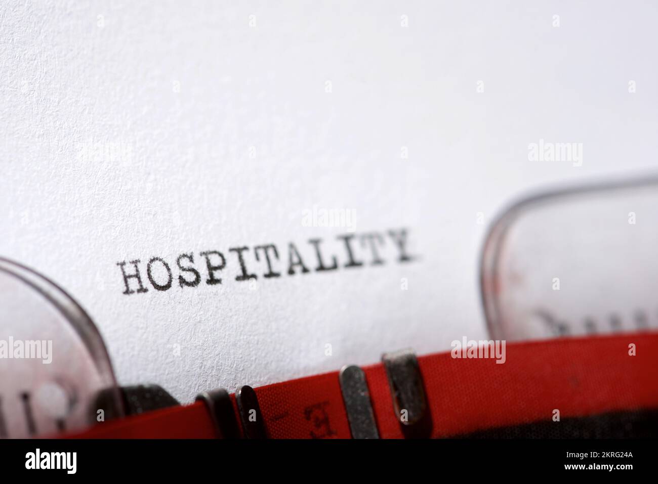 Hospitality word written with a typewriter. Stock Photo