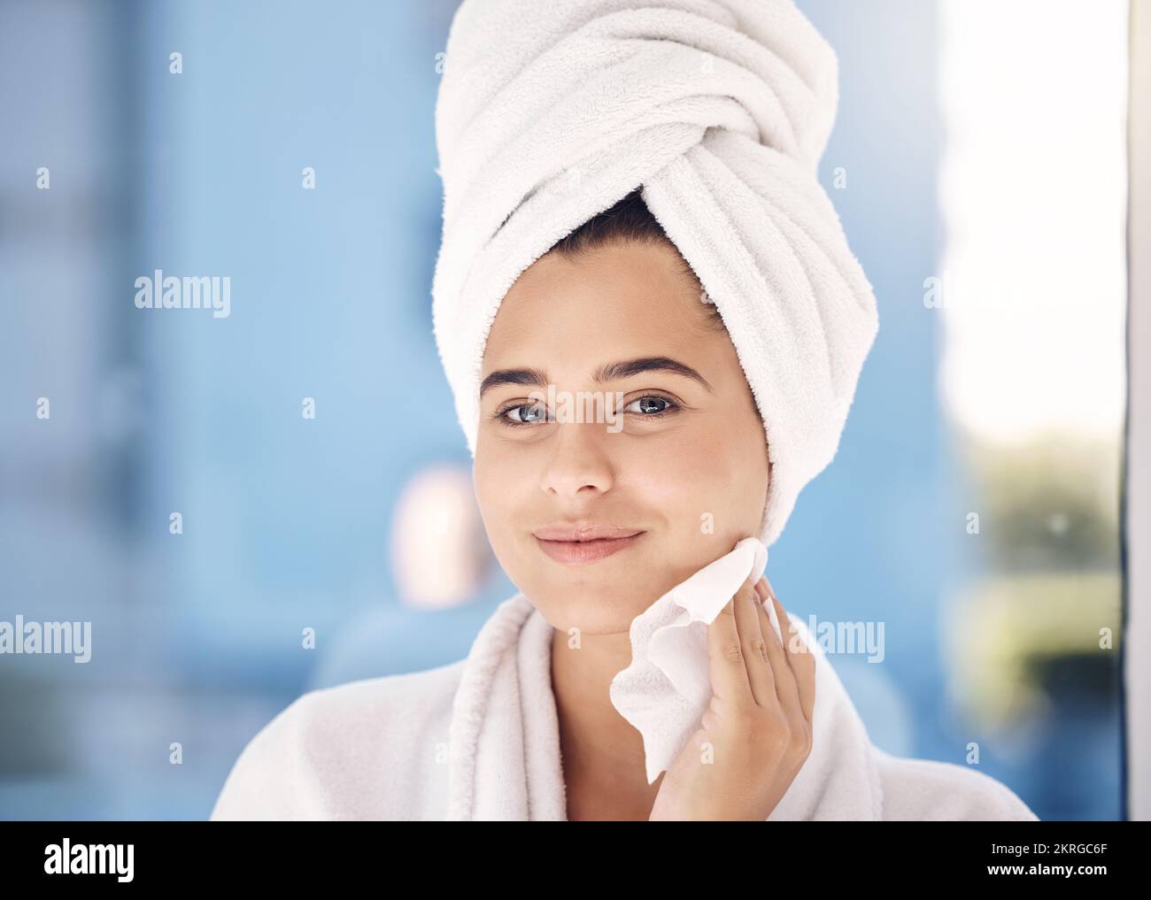 Beauty, face and cleaning with facial and woman after shower in towel