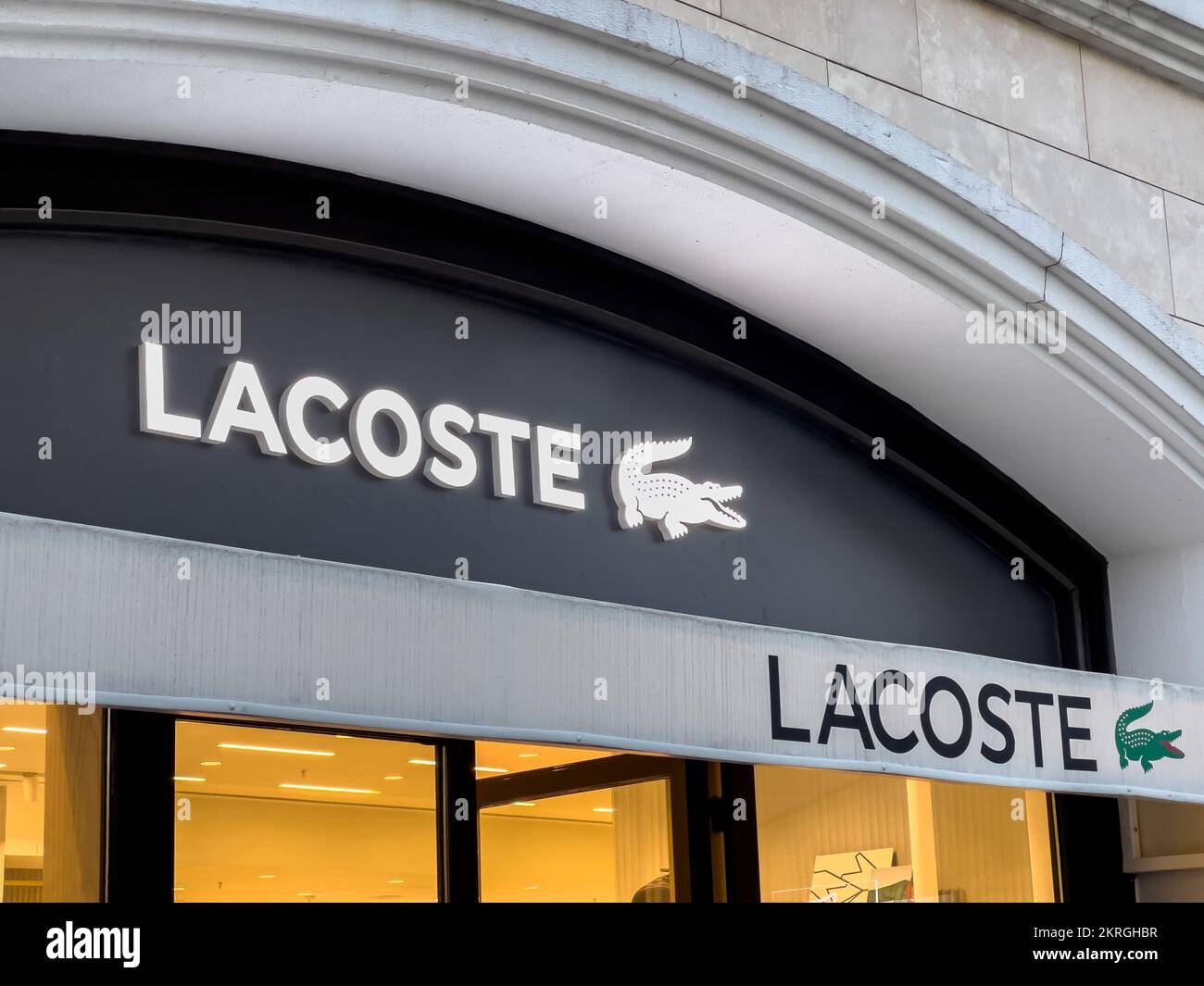 Antalya, Turkey - November 29, 2022: Illuminated logo of Lacoste store in Antalya Turkey Stock Photo