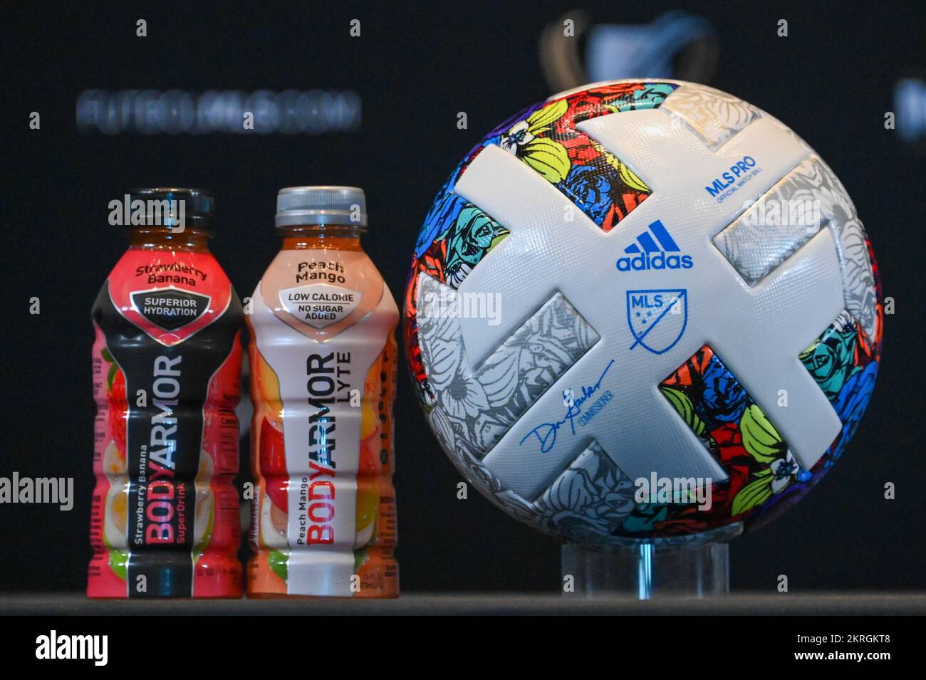 Detailed view of an Adidas MLS Soccer Ball next to two bottles of Body