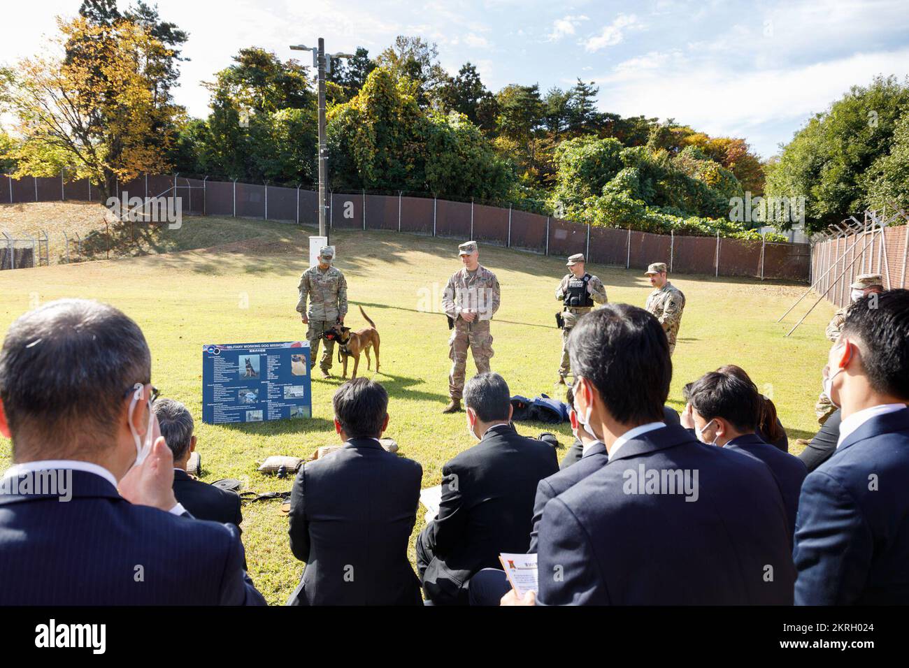 Military working dog handlers with the 901st Military Police Detachment at Camp Zama brief a group of visiting Japanese law enforcement officials on the unique capabilities of the detachment’s military working dogs. (Photo credit: Momoko Shindo) Stock Photo