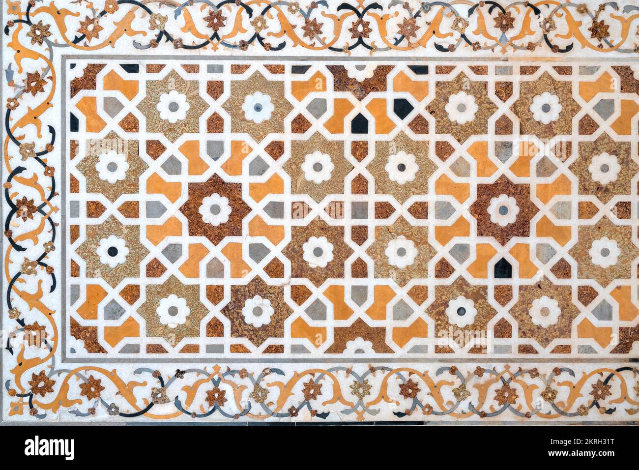Close-up of details of a marble wall with floral patterns and oriental mosaic on surface of Taj Mahal tomb in Agra, India Stock Photo