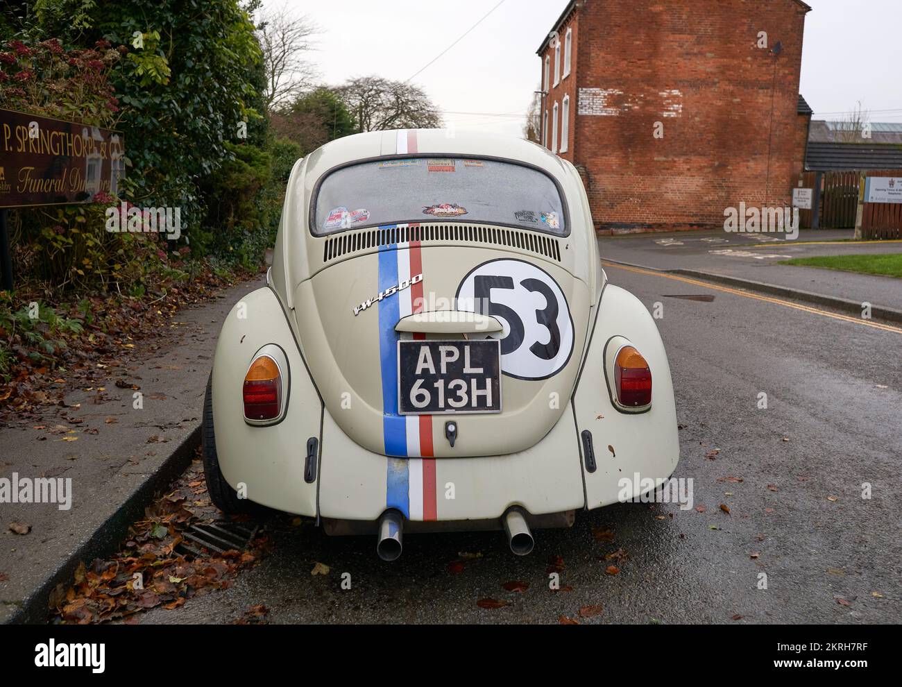 Iconic Volkswagen Beetle movie car replica parked on a road in Ashby de