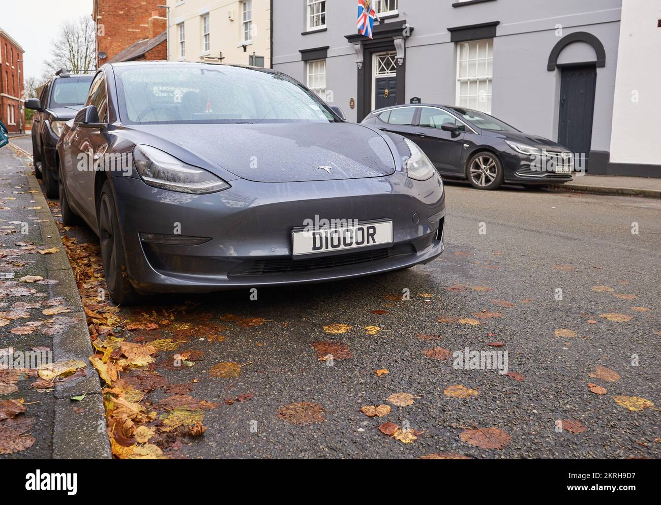 Grey Tesla electric car Parked on a side road in Ashby de la Zouch, UK