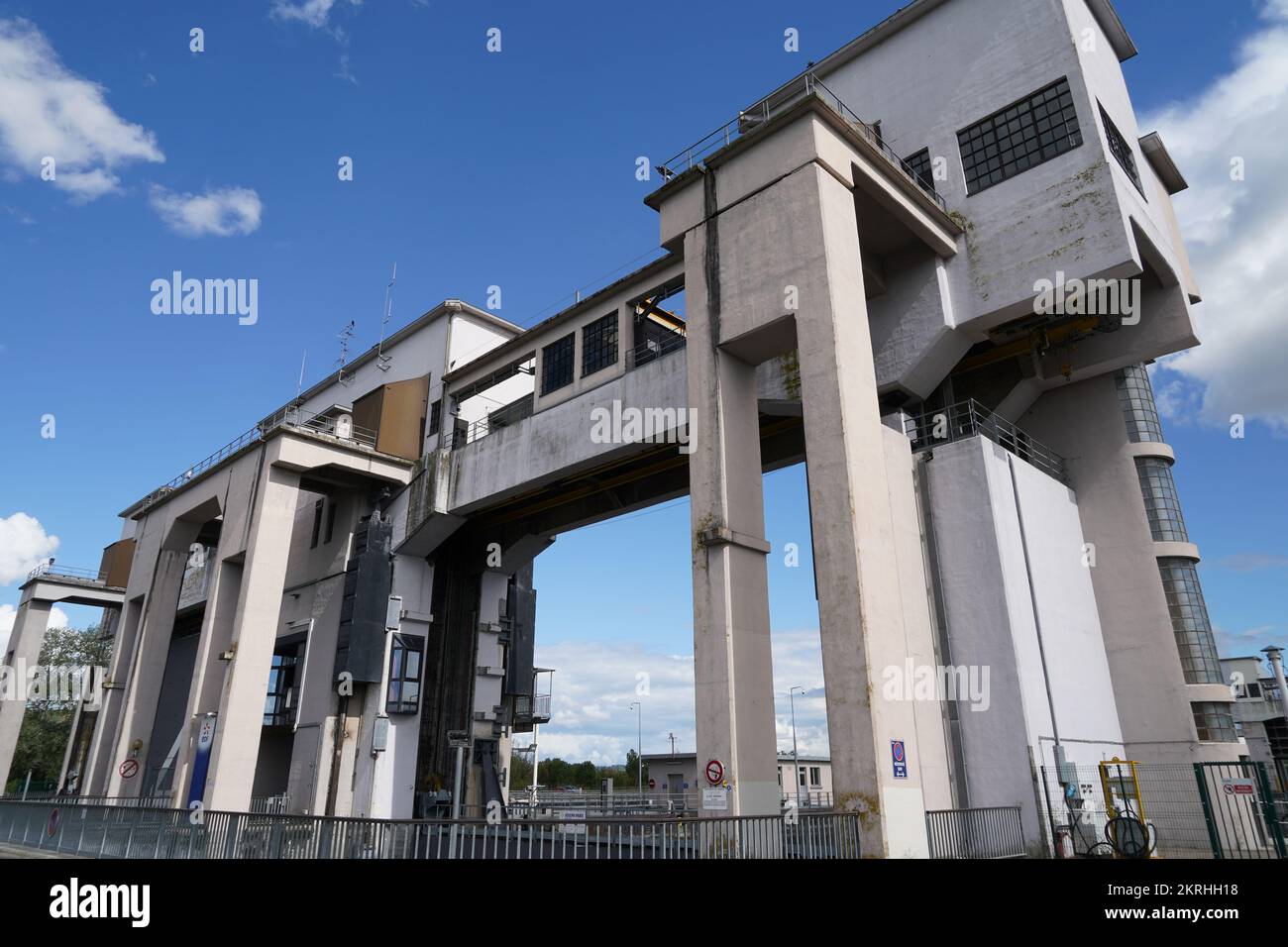 Low angle view on upper part construction of river locks with open gate. Stock Photo