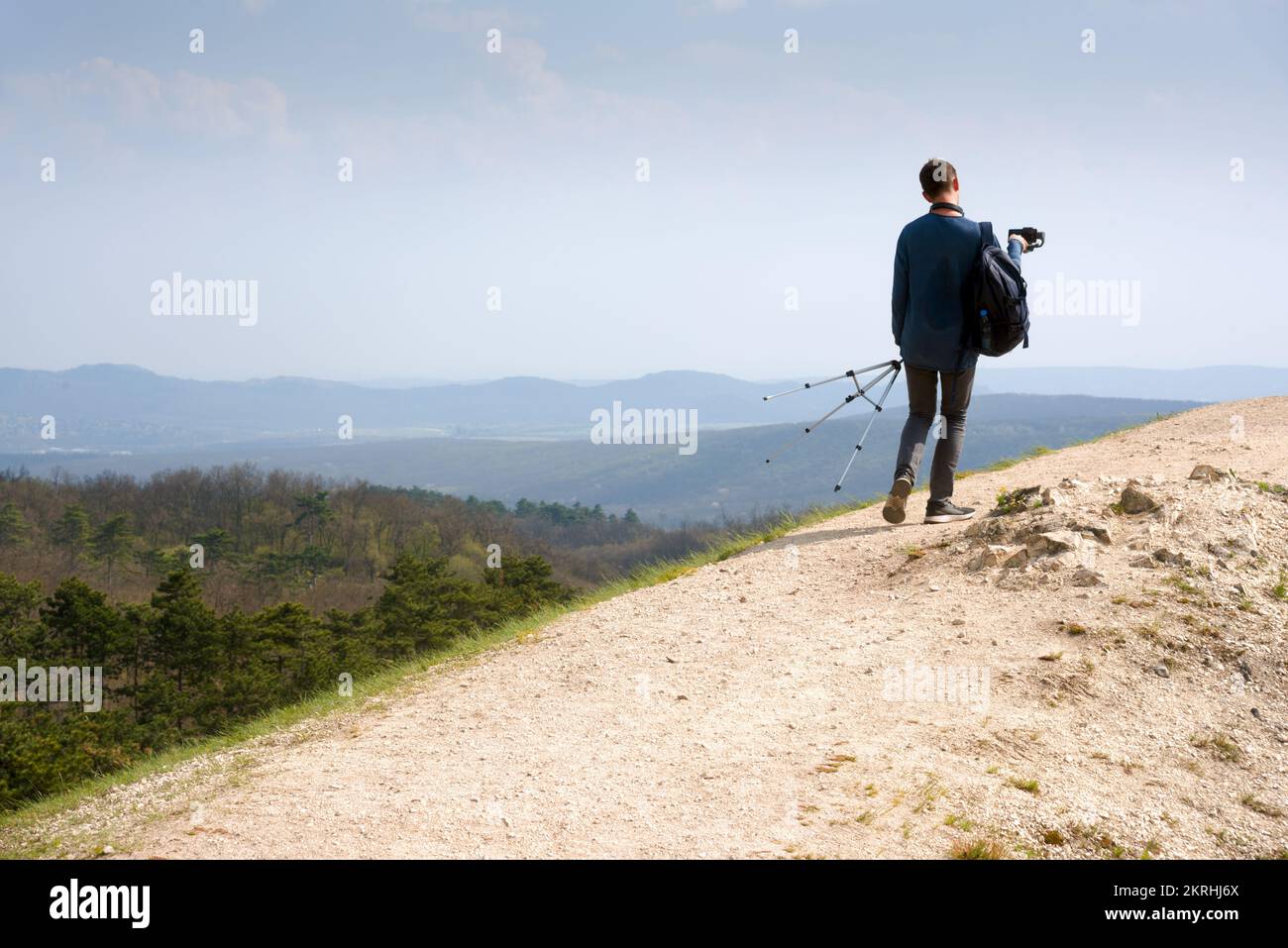 Young man walking in sun hi-res stock photography and images - Alamy