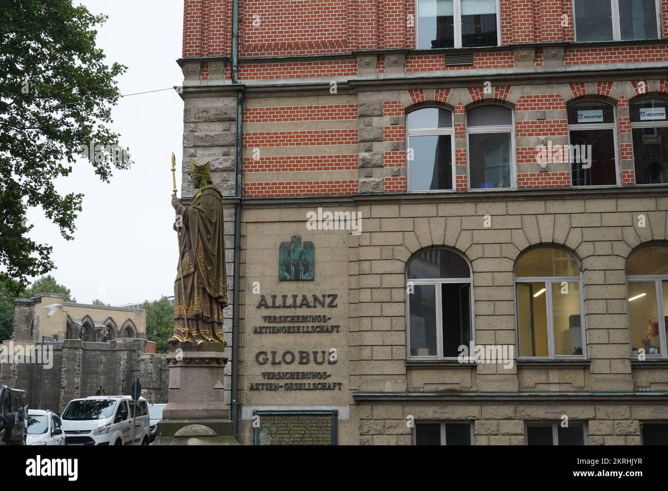 Historic building of Allianz and Globus, both with inscription insurance stock company in German language. Stock Photo