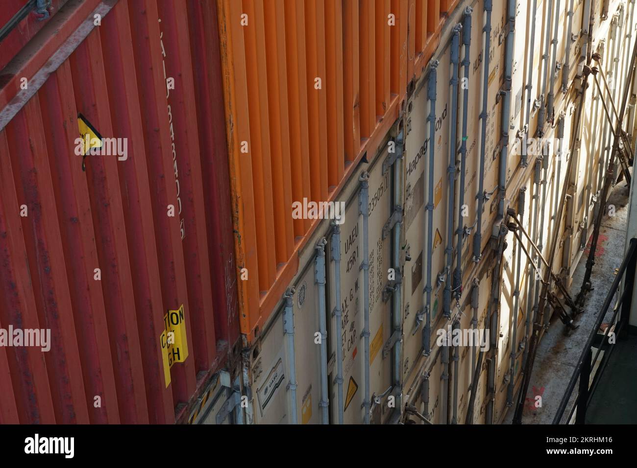 Aerial view on stack of different colors containers from various shippers. Stock Photo