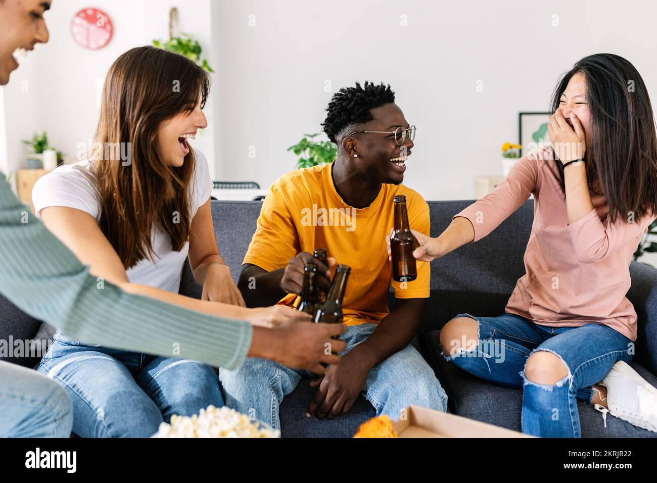 Group of young multiracial happy friends hanging out at home Stock Photo