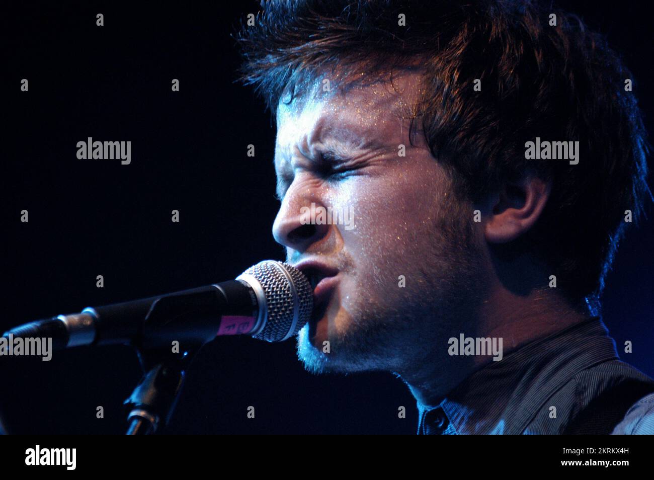 ROSS MILLARD, FUTUREHEADS, YOUNG, 2005: Ross Millard, singer and guitarist of the Futureheads on the NME Tour at Cardiff University, February 6 2005. Photograph: ROB WATKINS.  INFO: The Futureheads are a British rock band formed in 2000 in Sunderland. Known for their energetic, post-punk revival sound and catchy melodies, they gained prominence with their self-titled debut album and hits like 'Hounds of Love,' becoming influential in the indie rock scene. Stock Photo