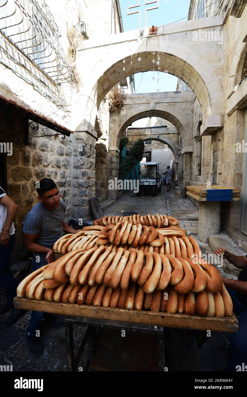 Fresh Ka’ek AlQuds Sesame bagel bread being delivered on a
