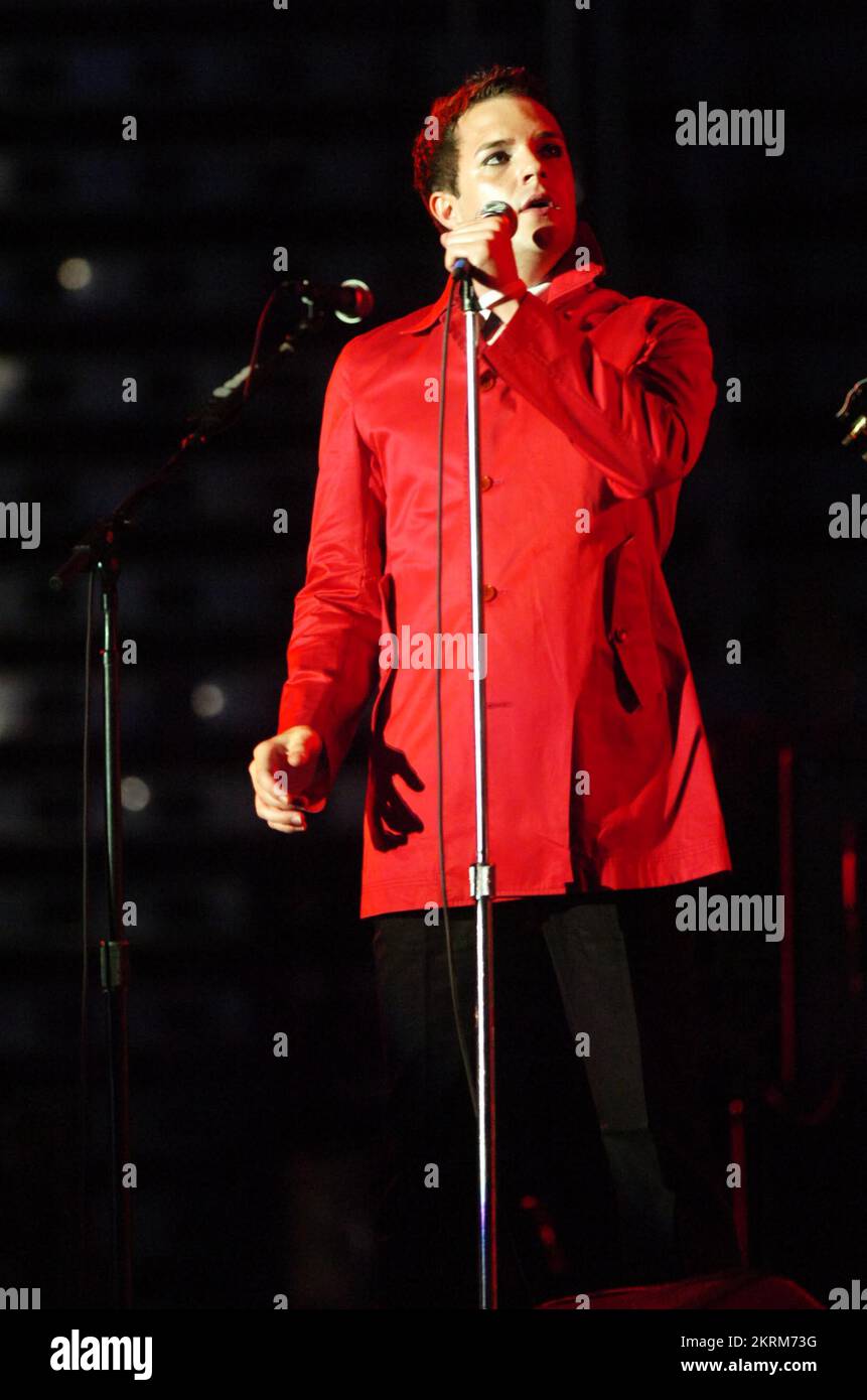 THE KILLERS singer BRANDON FLOWERS playing support to U2 at the Millennium Stadium in Cardiff, June 29 2005. Photograph: ROB WATKINS.  INFO: The Killers are an American rock band formed in Las Vegas in 2001. Known for their energetic sound and hits like 'Mr. Brightside,' they gained fame with their debut album 'Hot Fuss' and have remained influential in indie and alternative rock. Stock Photo