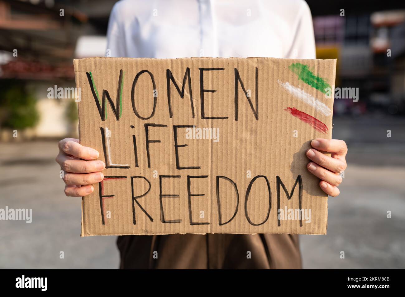 Woman protesting for women's rights in Iran Stock Photo