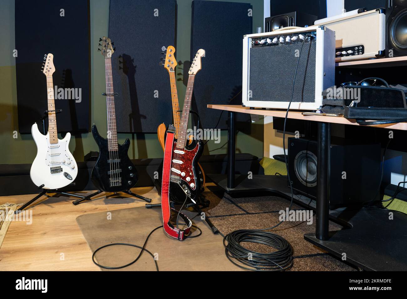 Contemporary music studio with electric and acoustic guitars placed on