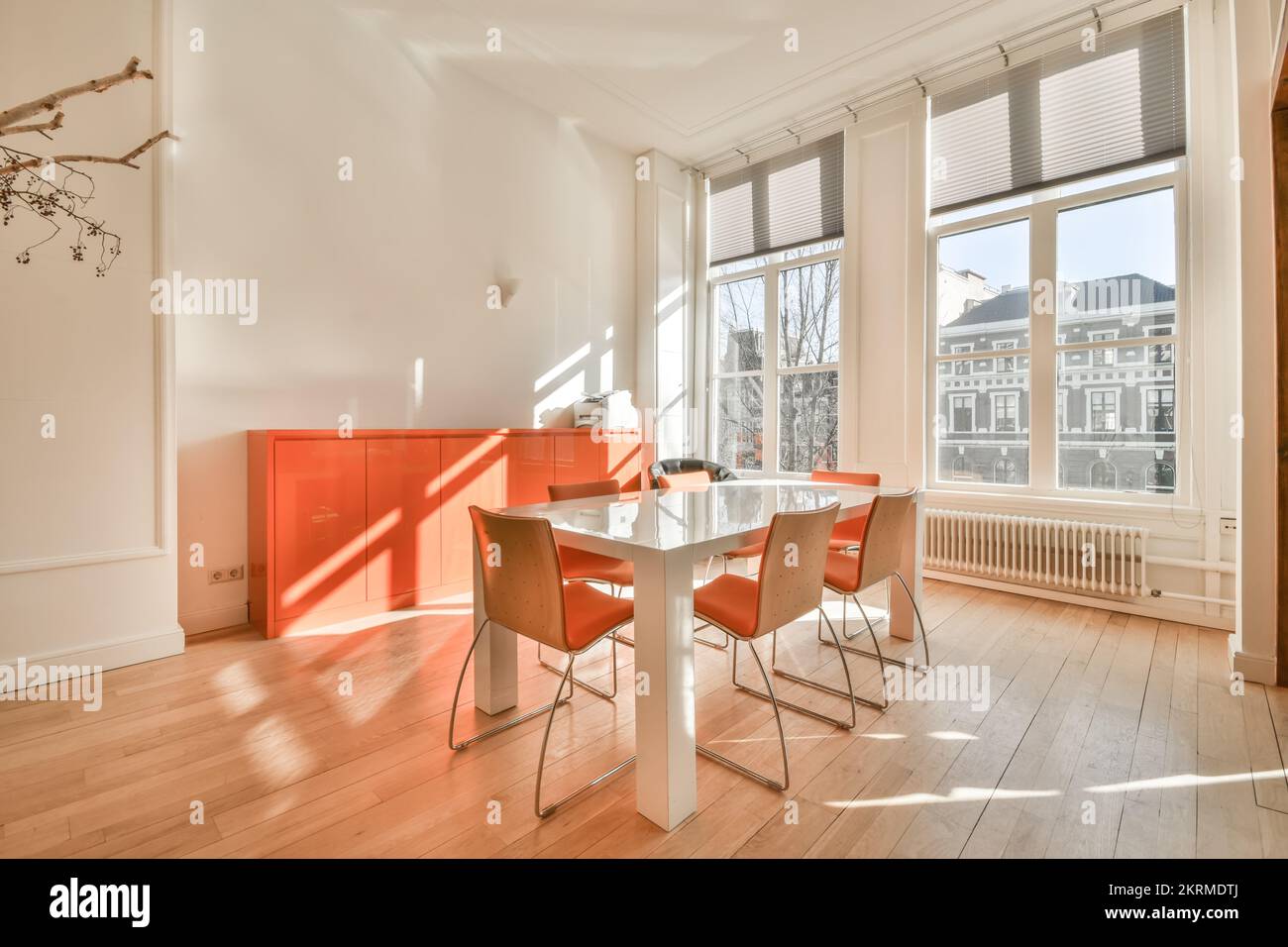 Bright empty conference room with table and chairs Stock Photo